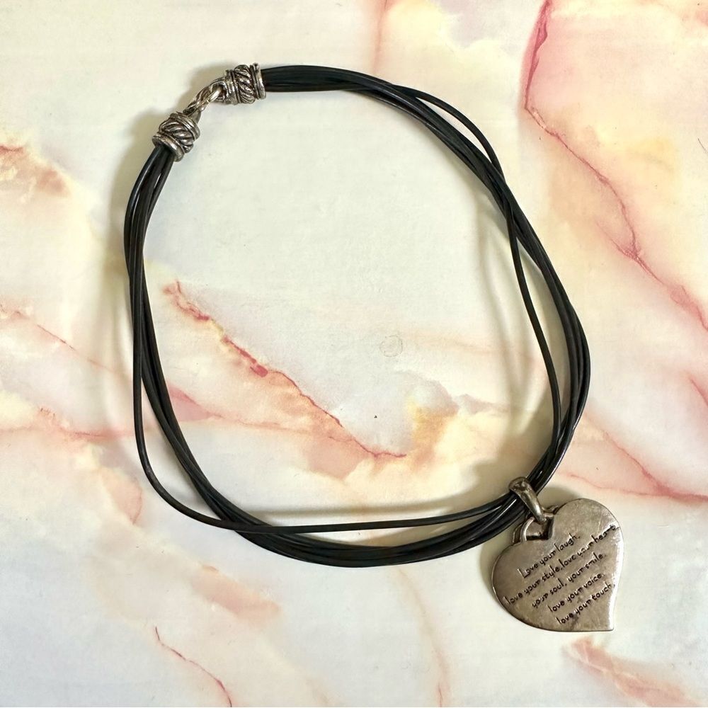 Silver tone double heart pendant necklace on black cord
